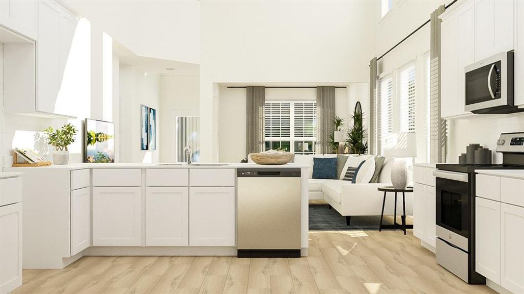 Kitchen featuring white cabinetry, light hardwood / wood-style flooring, and stainless steel appliances