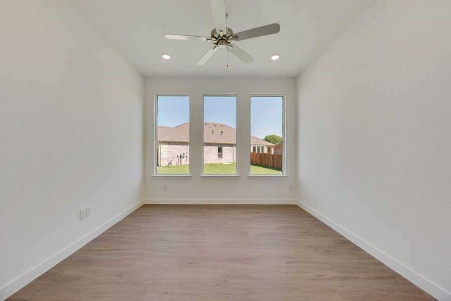 Unfurnished room with light wood-style flooring, ceiling fan, and recessed lighting