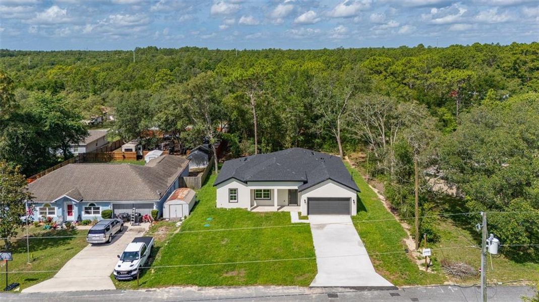 Front exterior of a new home in , Dunnellon, FL, highlighting curb appeal (Image 23).