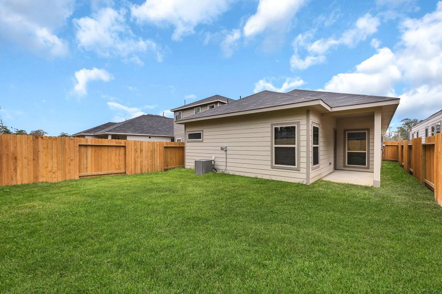 Exterior details and patio area of a home in Mill Creek Trails, Magnolia (Image 3).
