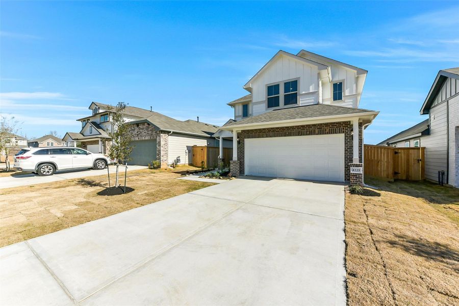 Front exterior of a new home in Colony at Pinehurst, Pinehurst, TX, highlighting curb appeal (Image 23). Front exterior of a new home in Colony at Pinehurst, Pinehurst, TX, highlighting curb appeal (Image 23).