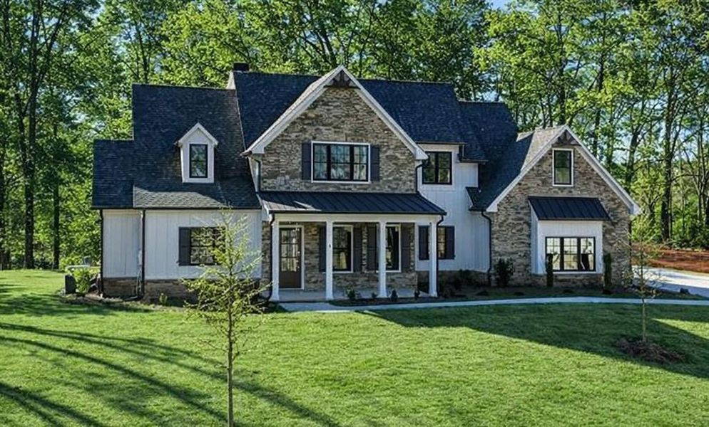 Front exterior of a new home in , Canton, GA, highlighting curb appeal (Image 25). Front exterior of a new home in , Canton, GA, highlighting curb appeal (Image 25).