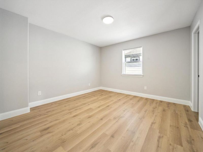 Unfurnished room with light wood-type flooring