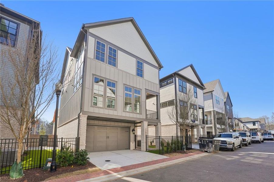Front exterior of a new home in Park Walke, Alpharetta, GA, highlighting curb appeal (Image 27).