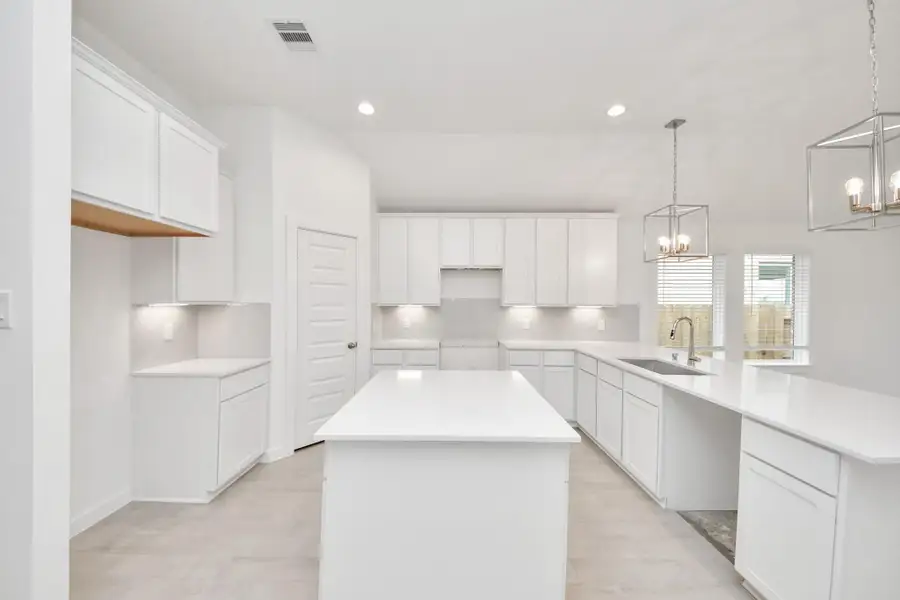This kitchen is by far any chef’s dream! This spacious kitchen features high ceilings, light stained wood cabinets, granite countertop, SS appliances, modern tile backsplash, recessed lighting, extended counter space, granite kitchen island with double sink, and space for breakfast bar, and a walk-in pantry all overlooking your huge family room. Sample photo of completed home with similar floor plan. Actual colors and selections may vary. This kitchen is by far any chef’s dream! This spacious kitchen features high ceilings, light stained wood cabinets, granite countertop, SS appliances, modern tile backsplash, recessed lighting, extended counter space, granite kitchen island with double sink, and space for breakfast bar, and a walk-in pantry all overlooking your huge family room. Sample photo of completed home with similar floor plan. Actual colors and selections may vary.