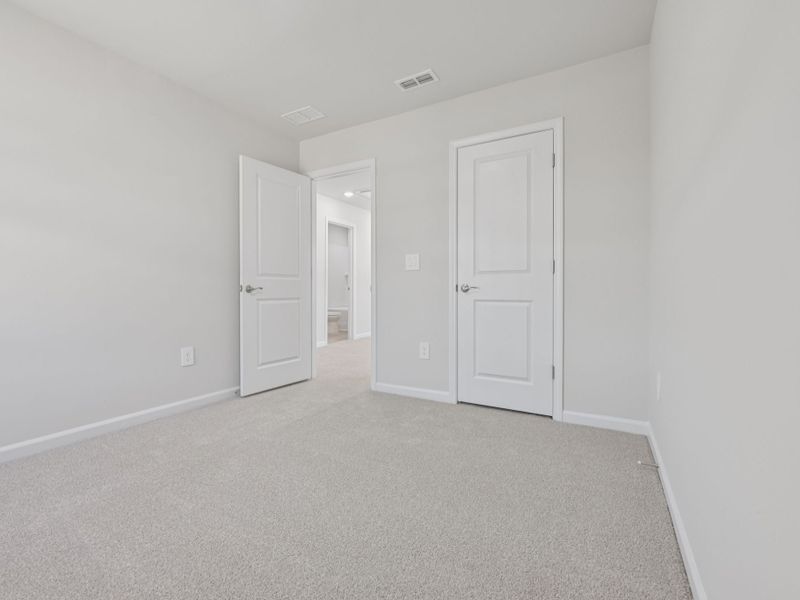 Spacious, unfurnished interior of a new home in The Rows at Buffaloe Reserve, Raleigh (Image 13).