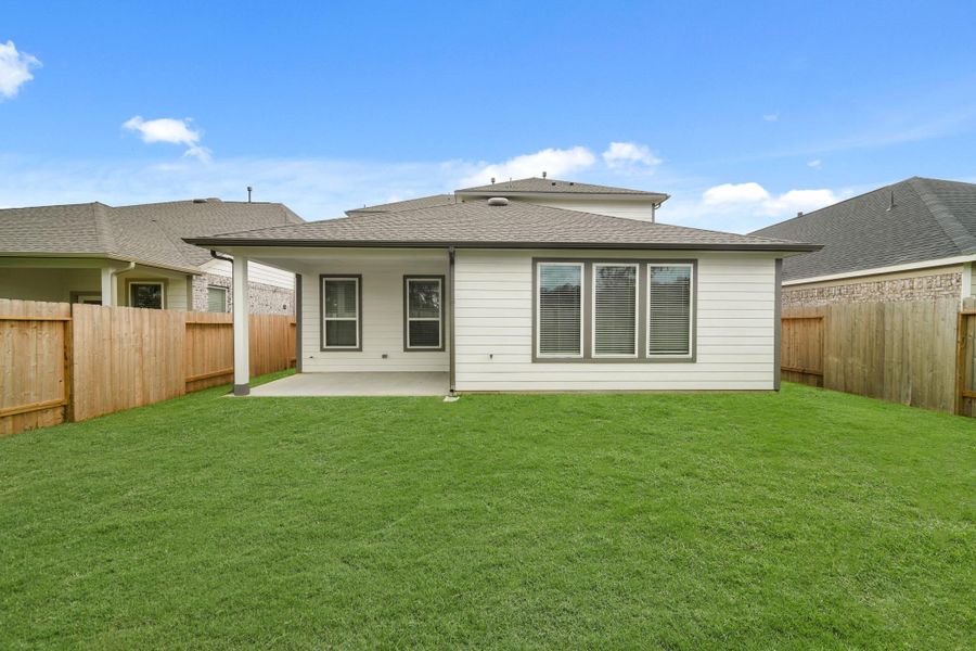 Front exterior of a new home in Barton Creek Ranch, Conroe, TX, highlighting curb appeal (Image 14). Front exterior of a new home in Barton Creek Ranch, Conroe, TX, highlighting curb appeal (Image 14).