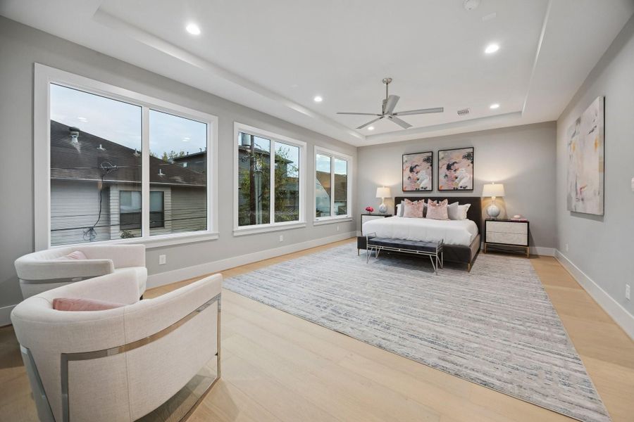 Primary Bedroom with a Coffered Ceiling.