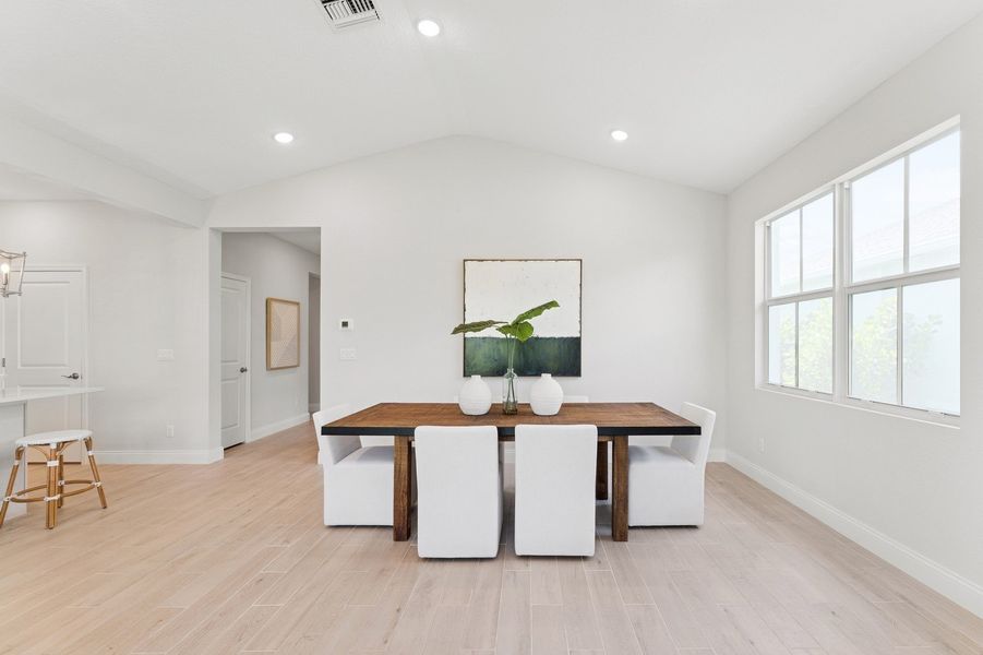 Dining area with vaulted ceiling