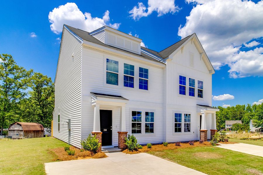 Front exterior of a new home in Padgett Commons, Hopkins, SC, highlighting curb appeal (Image 2). Front exterior of a new home in Padgett Commons, Hopkins, SC, highlighting curb appeal (Image 2).