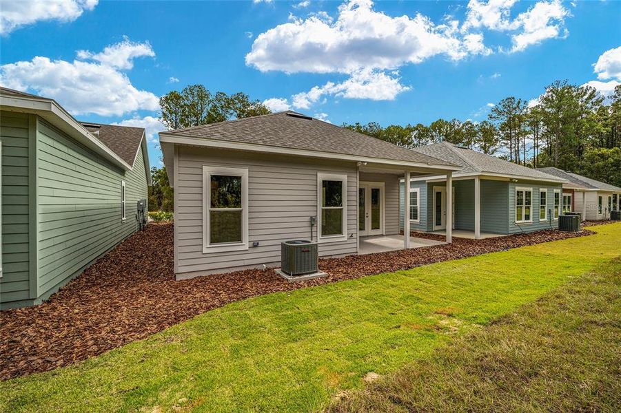 Front exterior of a new home in Fairway Pointe at West End, Newberry, FL, highlighting curb appeal (Image 23).