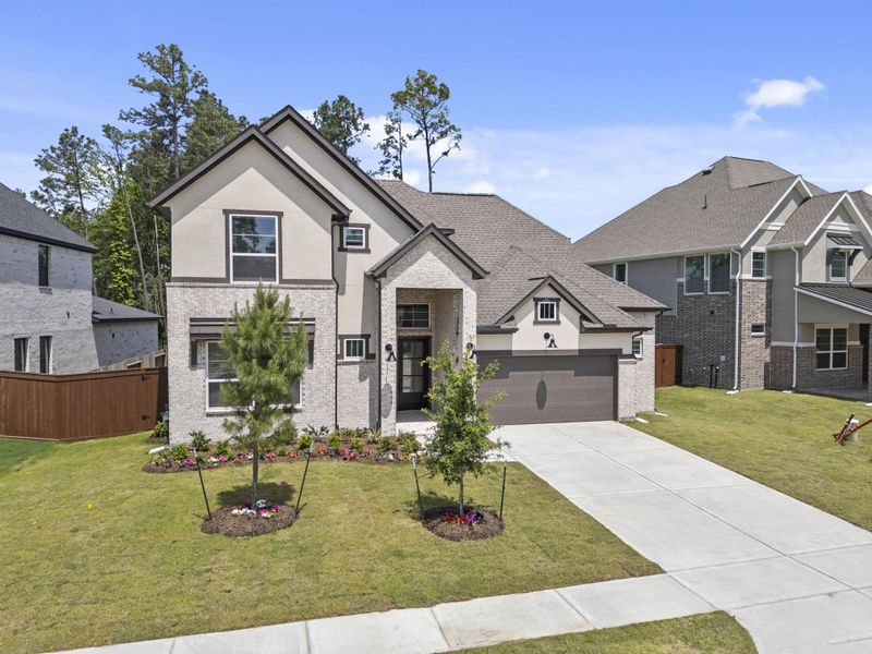 Front exterior of a new home in Evergreen, Conroe, TX, highlighting curb appeal (Image 24).