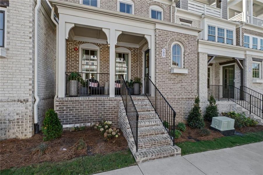 Exterior details and patio area of a home in South on Main, Woodstock (Image 25).