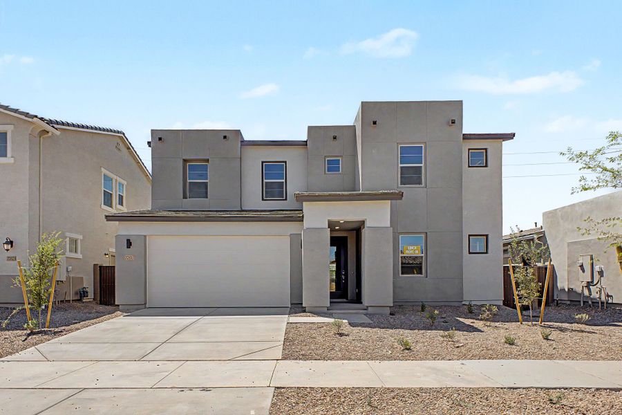 Front exterior of a new home in Empire Pointe, Queen Creek, AZ, highlighting curb appeal (Image 1). Front exterior of a new home in Empire Pointe, Queen Creek, AZ, highlighting curb appeal (Image 1).