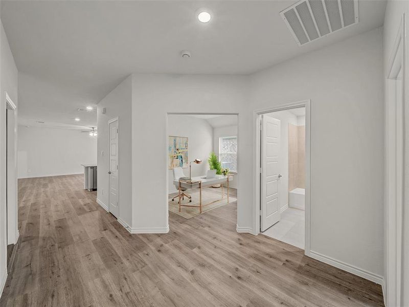 Hall featuring recessed lighting, light wood-style floors, and an office area