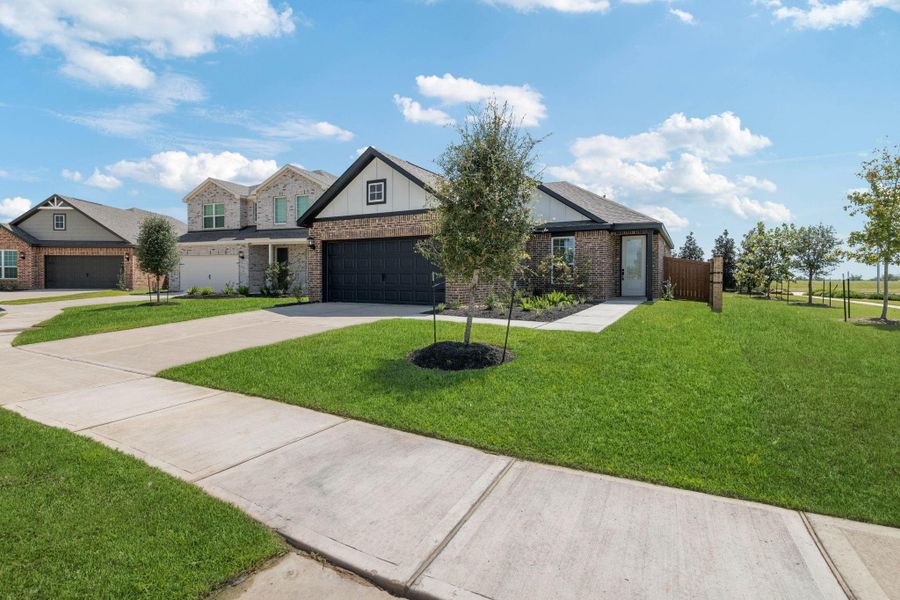 Front exterior of a new home in Emberly, Beasley, TX, highlighting curb appeal (Image 1). Front exterior of a new home in Emberly, Beasley, TX, highlighting curb appeal (Image 1).