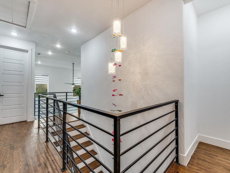 Stairs with attic access, wood finished floors, and recessed lighting