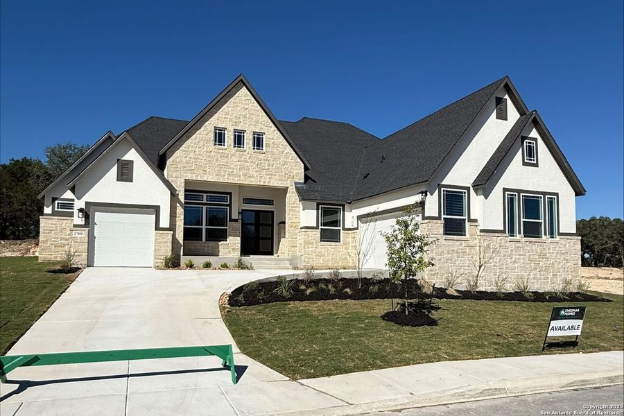 Front exterior of a new home in Caliza Reserve, Boerne, TX, highlighting curb appeal (Image 1).
