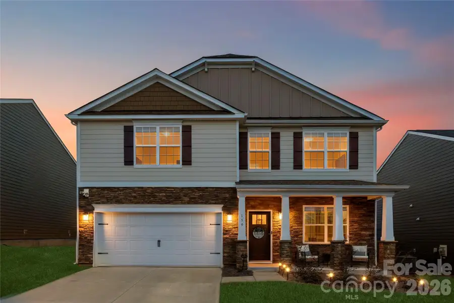 Front exterior of a new home in Calvin Creek, Troutman, NC, highlighting curb appeal (Image 21).