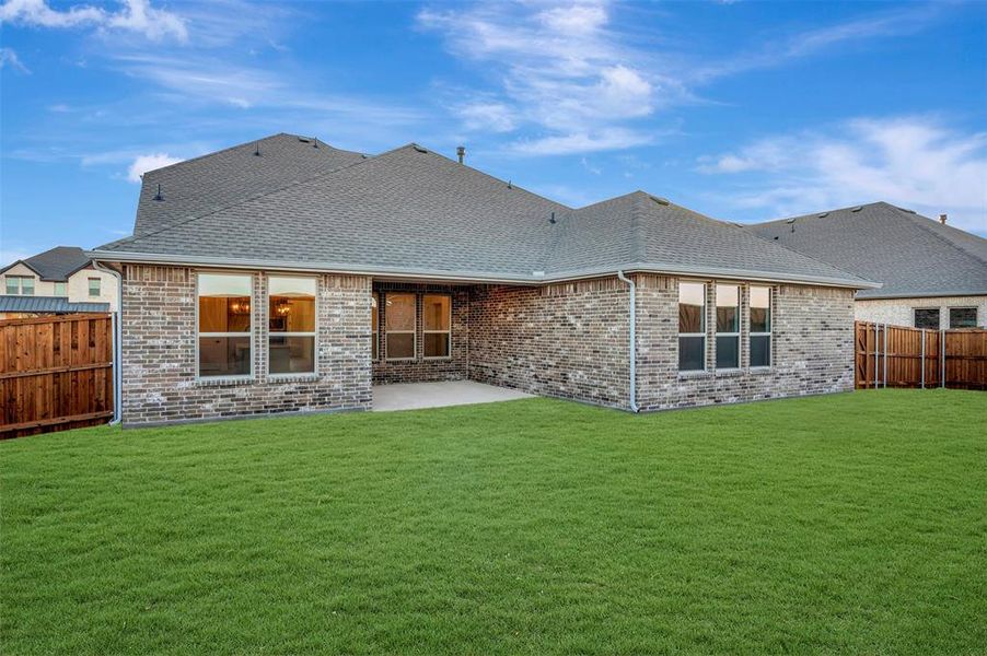 Exterior details and patio area of a home in Kreymer at the Park, Wylie (Image 3). Exterior details and patio area of a home in Kreymer at the Park, Wylie (Image 3).