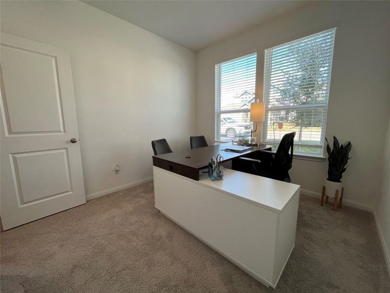 downstairs guest bedroom/office with large walk in closet