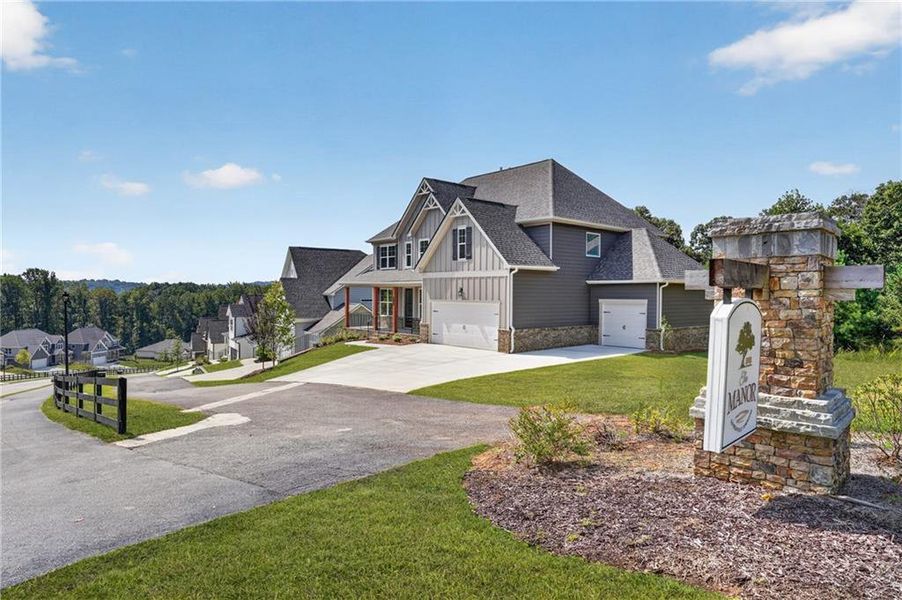 Front exterior of a new home in The Manor at Gainesville Township, Gainesville, GA, highlighting curb appeal (Image 23).