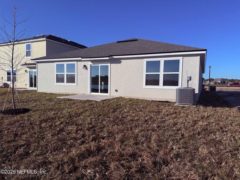 Exterior details and patio area of a home in The Arbors, Jacksonville (Image 4).