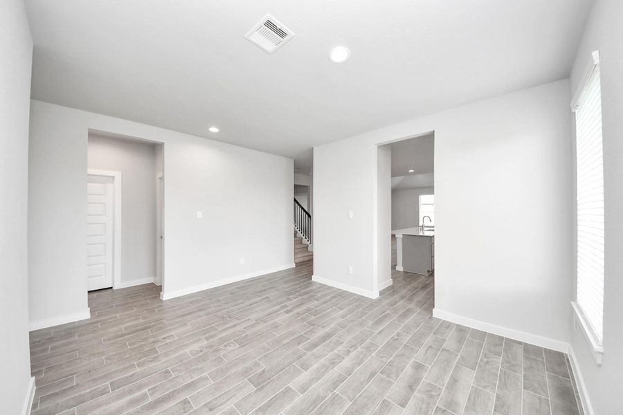 Make memories gathered around the table with your family and friends! This spacious dining room features elegant flooring, custom paint, and adjacent to family room and kitchen for open concept feel. Make memories gathered around the table with your family and friends! This spacious dining room features elegant flooring, custom paint, and adjacent to family room and kitchen for open concept feel.