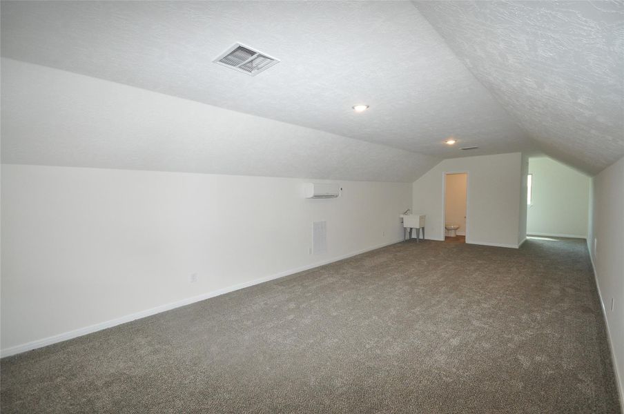 Above Garage 1 are 2 large finished rooms and a full bath.