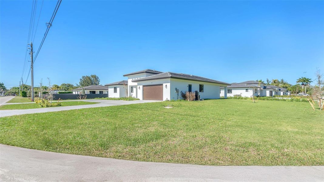 Front exterior of a new home in , Miami, FL, highlighting curb appeal (Image 27).