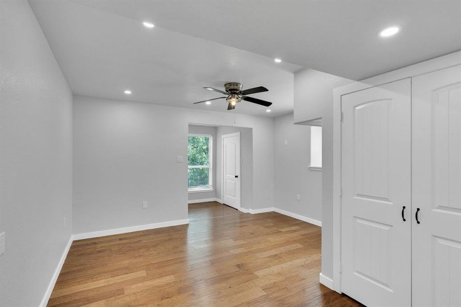 Upstairs Bedroom with light wood-style floors, recessed lighting, baseboards, and a ceiling fan