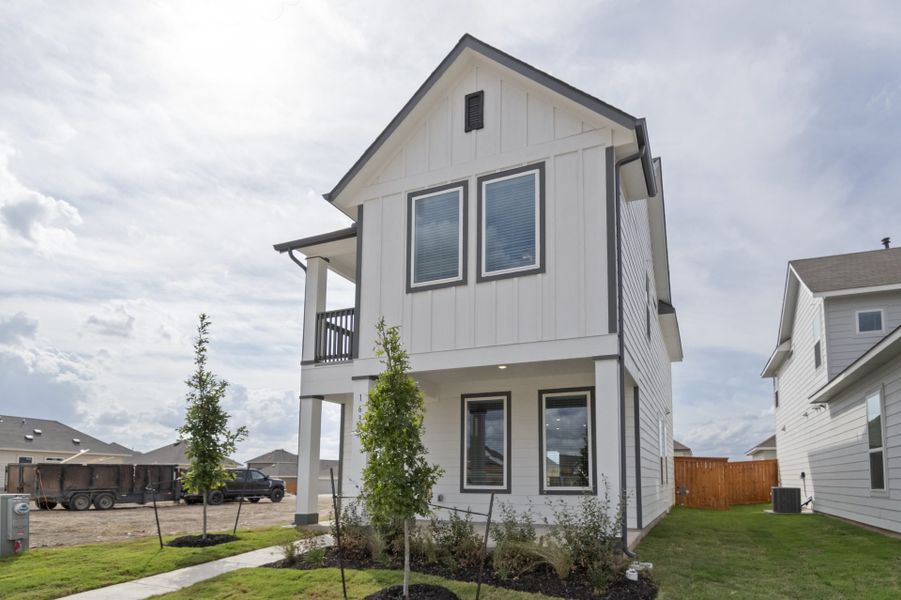 Front exterior of a new home in Trace, San Marcos, TX, highlighting curb appeal (Image 29).