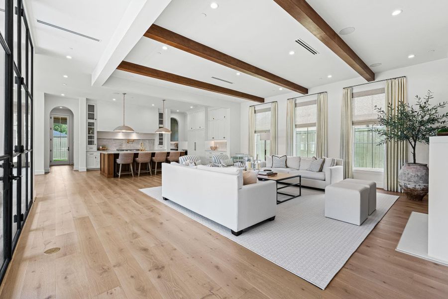 The family room opens seamlessly to the kitchen & breakfast area, creating a natural flow ideal for everyday living & entertaining. Expansive windows on the left and right draw in tons of natural light, enhancing the open, connected feel of the space. The family room opens seamlessly to the kitchen & breakfast area, creating a natural flow ideal for everyday living & entertaining. Expansive windows on the left and right draw in tons of natural light, enhancing the open, connected feel of the space.