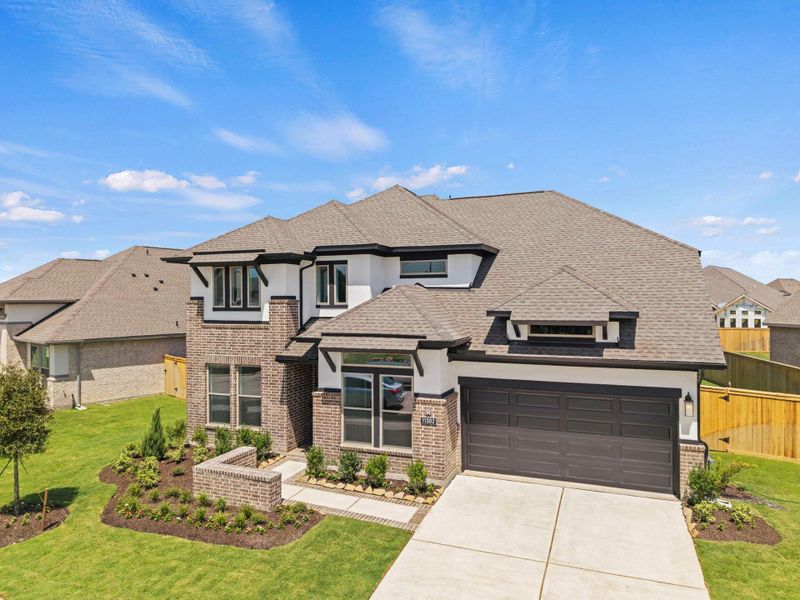Front exterior of a new home in Bridgeland, Cypress, TX, highlighting curb appeal (Image 15).