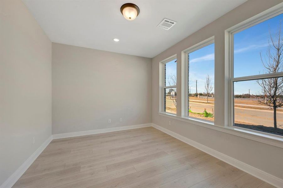 Unfurnished room featuring light wood-style floors and recessed lighting