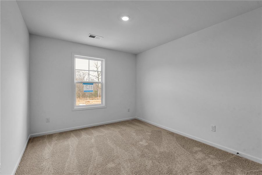 This spacious room offers comfort with carpet floo This spacious room offers comfort with carpet floo