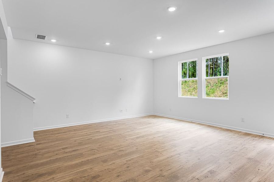 Representative unfurnished interior of a home built from the Avera by Taylor Morrison in Falls Creek, Flowery Branch (Image 12).