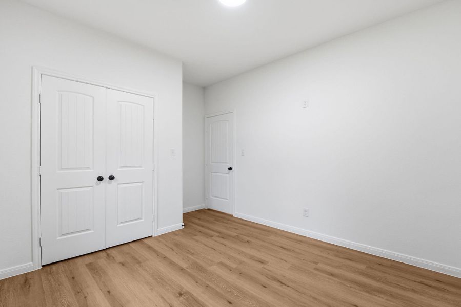 Third bedroom with double doors closet