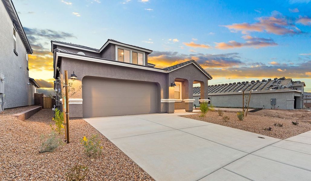 Representative exterior photo of a completed home built from the Juniper by D.R. Horton in The Oasis at Rocking K, Vail, AZ (Image 27).