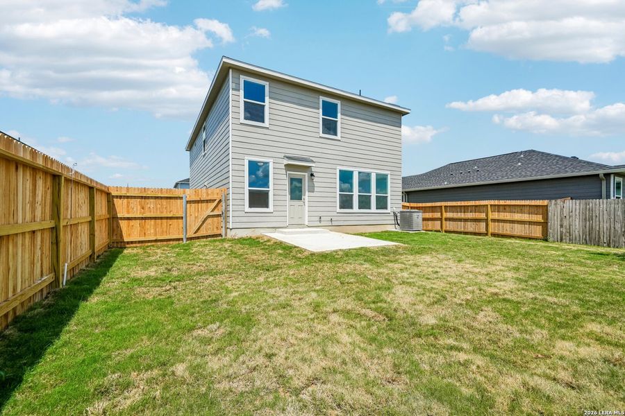 Exterior details and patio area of a home in Woodside Farms, Seguin (Image 17).