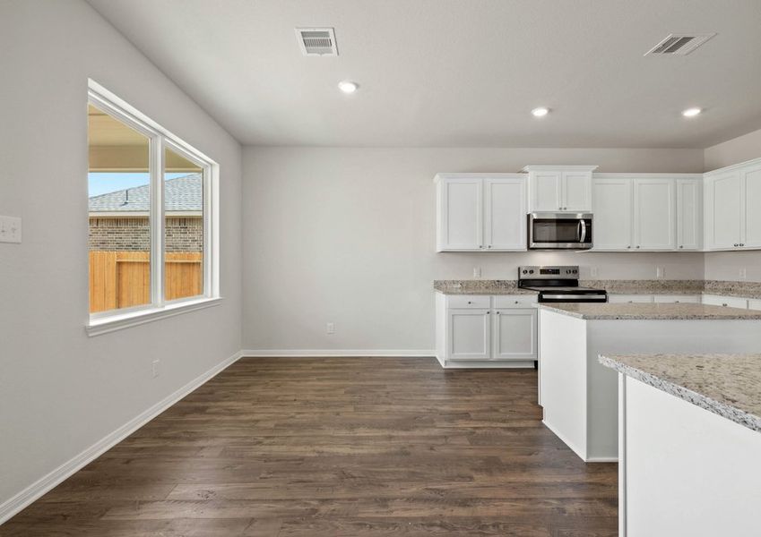 Dining room with a view of the backyard Dining room with a view of the backyard