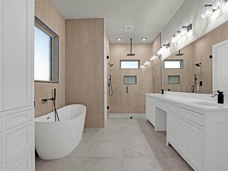 Bathroom with vanity, tile walls, and separate shower and tub