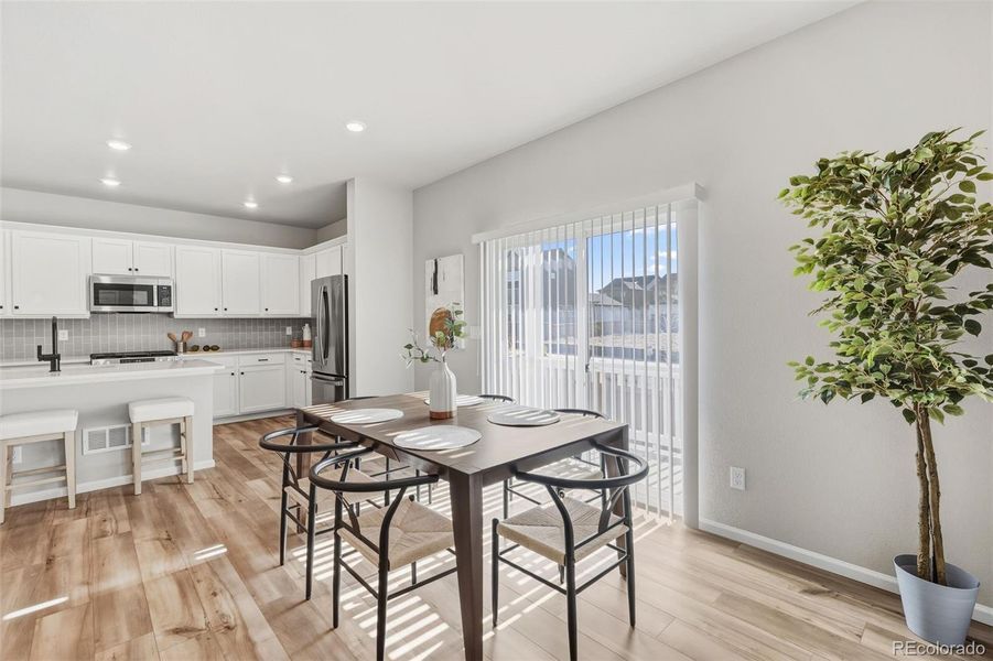 Furnished interior view inside a new home in Woodrose at Painted Prairie, Aurora (Image 16).