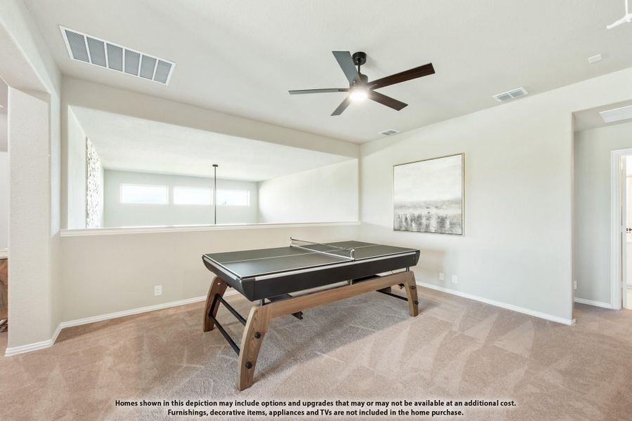 Game room with ping pong table, ceiling fan, carpet flooring, and neutral walls Game room with ping pong table, ceiling fan, carpet flooring, and neutral walls