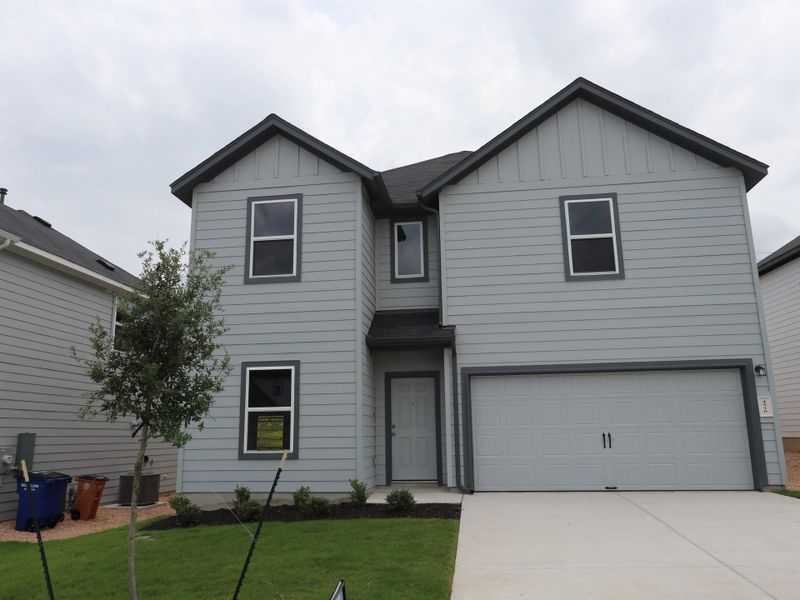 Front exterior of a new home in Cascades at Onion Creek, Austin, TX, highlighting curb appeal (Image 2). Front exterior of a new home in Cascades at Onion Creek, Austin, TX, highlighting curb appeal (Image 2).