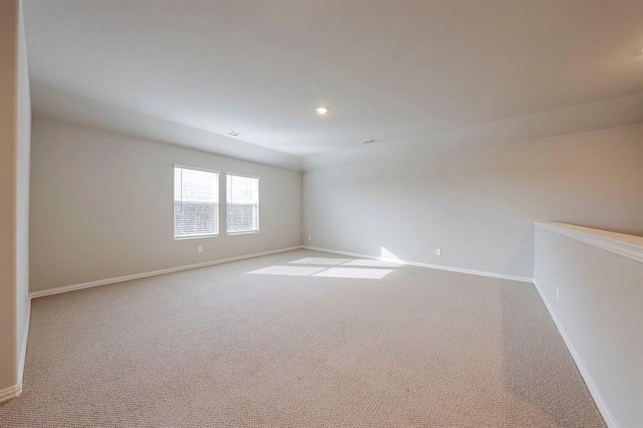 Empty room with carpet floors and recessed lighting Empty room with carpet floors and recessed lighting