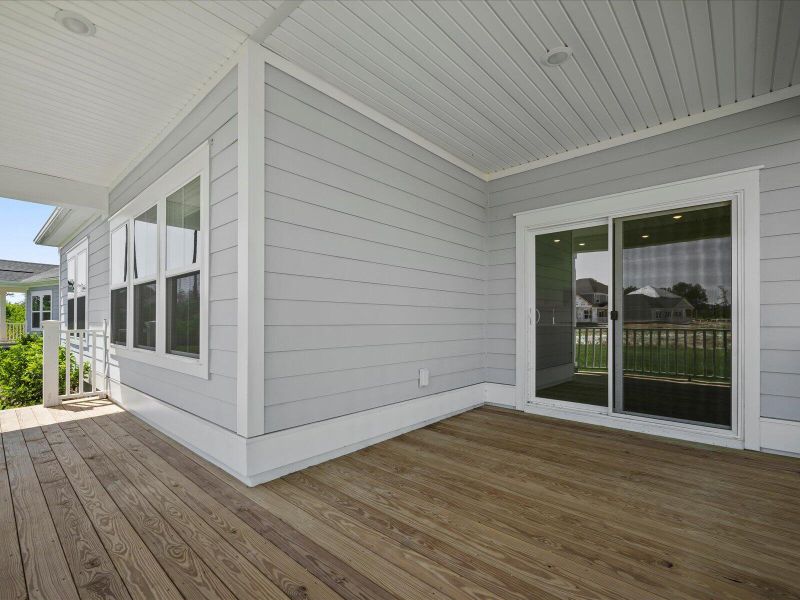 Exterior details and patio area of a home in The Coves at Lakes of Cane Bay, Summerville (Image 14).