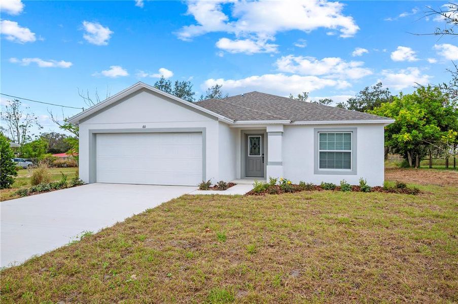 Exterior details and patio area of a home in , Frostproof (Image 2). Exterior details and patio area of a home in , Frostproof (Image 2).