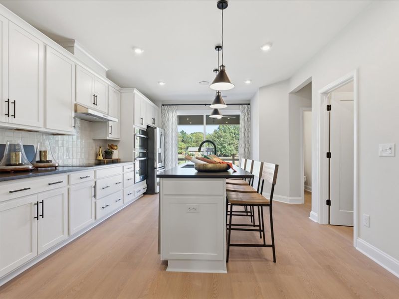 Representative furnished interior of a home built from the Dahlia by Tri Pointe Homes in Bellflower, Charlotte (Image 21).