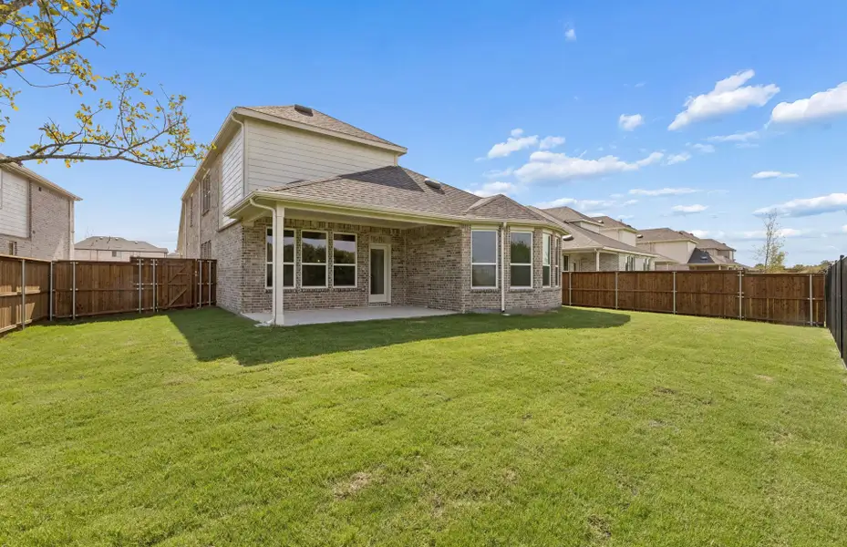 Exterior details and patio area of a home in Creekview Meadows, Pilot Point (Image 2).